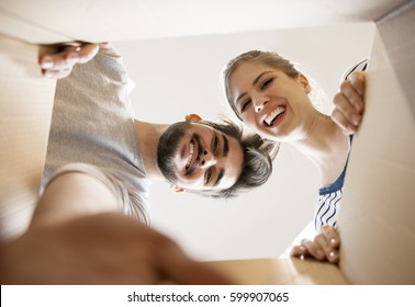 Young Couple Looking Into The Box