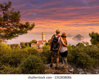 Young couple at looking at the scene at Cape Gelidonya Lighthous - Powered by Shutterstock