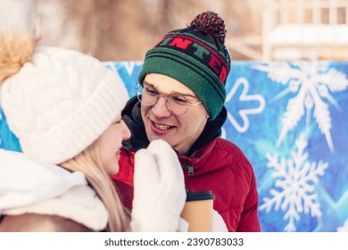 Young couple in love have fun, active date ice skating on the ice arena on a winter day.Laughing teenagers relax on a bench,drink hot cocoa,talk.Winter entertainment,leisure activity,Valentine's day. - Powered by Shutterstock