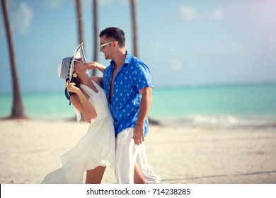 Young Couple In Love Have Fun, Dancing On The Exotic Beach. (couple Out Of Focus)