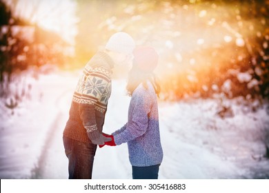 Young Couple In Love Holding Hands Outdoor In Winter At Sunset