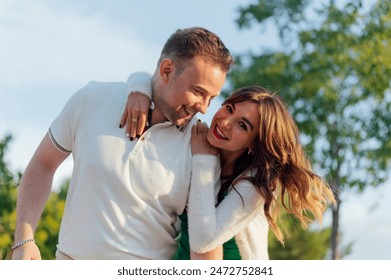 Young couple in love hugging in the park - Powered by Shutterstock