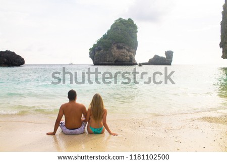 Young couple in love looking at the sea in Koh Phi Phi, Thailand