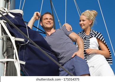 Young Couple In Love Makes Holiday On A Sailboat