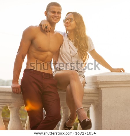 Young couple in love outdoor. Romantic young couple enjoying sun, sunshine, romance and love.