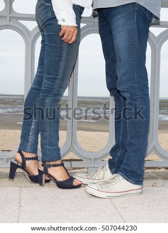 Young couple in love standing outside in summer or spring