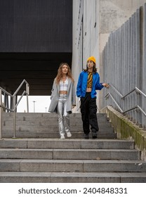 young couple in love talking while taking a walk through the city.