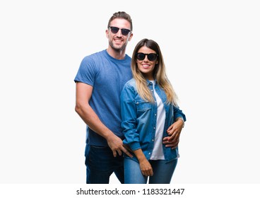 Young Couple In Love Wearing Sunglasses Over Isolated Background With A Happy And Cool Smile On Face. Lucky Person.