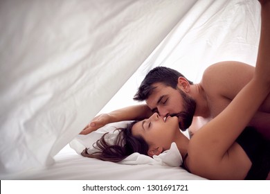 Young couple lovers having sex on a bed in morning with lust and love. Sex couple. Having sex.