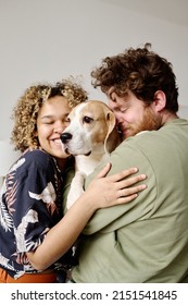 Young Couple Loving Their Dog