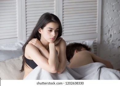 Young Couple Lying In Bed Under Blanket In Bedroom At Home, Man Sleeping, Pensive Frustrated Woman In Lingerie Thinking About Relationships, Cheat, Treason, Family Having Sexual Problems Close Up