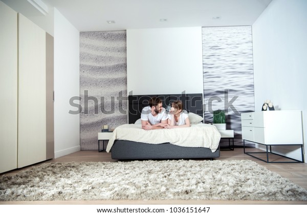 Young Couple Lying Bedroom Modern Interior Stock Photo Edit Now 1036151647