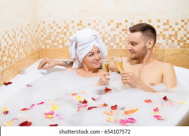 young couple lying in jacuzzi,concept of romantic love