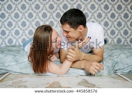 Similar – Man looking to beautiful woman lying on bed