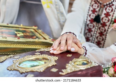 A Young Couple Makes A Marriage Vow On The Gospel During A Church Wedding.