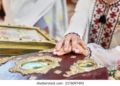 A Young Couple Makes A Marriage Vow On The Gospel During A Church Wedding.