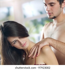 Young Couple Making Massage At Home