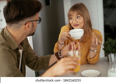 Young Couple Making Sandwich At Home. Loving Couple Enjoying In The Kitchen.	