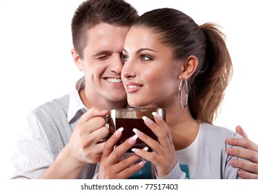 Young Couple Of Man And Woman Drinking Tea