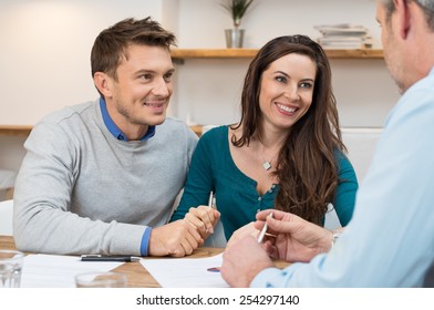 Young couple meeting financial advisor for investment