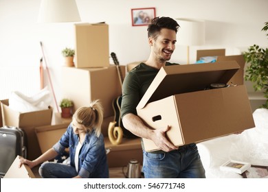 Young couple moving in to house 