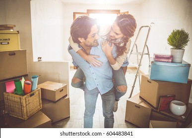 Young Couple Moving In Into New Apartment