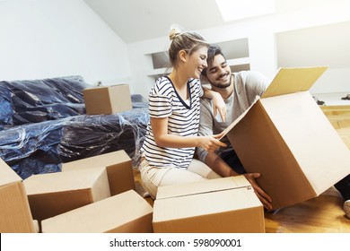 Young Couple Moving Into Their New Home