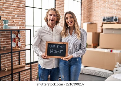 Young Couple Moving To A New Home Smiling And Laughing Hard Out Loud Because Funny Crazy Joke. 