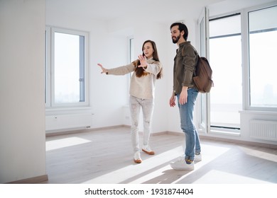 Young Couple Moving And Planning In New Flat, New Home And Relocation Concept.