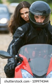 Young Couple On Beautiful Bike On Road.