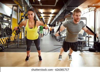 Young Couple On Body Training In Gym