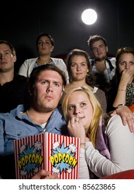 Young Couple On A Date At The Movie Theater