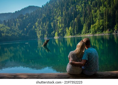 Young couple on the lake. Small Ritsa. - Shutterstock ID 2197352223