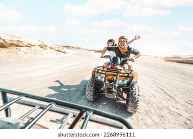 Young couple on a off road adventure excursion outside - Joyful tourists enjoying weekend activity on summer vacation - Tourism tour activities, transportation and summertime holidays concept - Shutterstock ID 2268996111