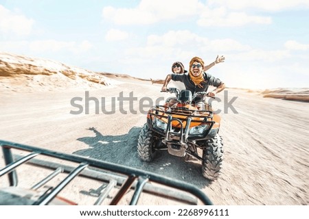 Young couple on a off road adventure excursion outside - Joyful tourists enjoying weekend activity on summer vacation - Tourism tour activities, transportation and summertime holidays concept