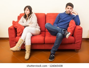 Young Couple on the Sofa after Quarrel - Powered by Shutterstock