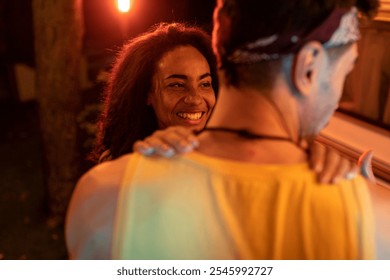 Young couple on vacation with the camper. Dancing outdoor in the night. Concept about wanderlust road trips and lifestyle on vacation - Powered by Shutterstock