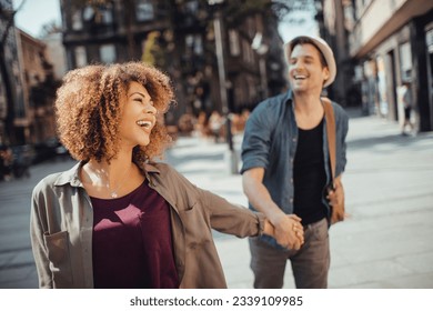 Young couple on a vacation exploring the city - Powered by Shutterstock