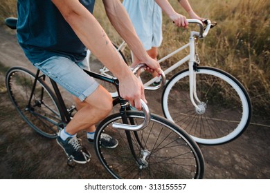 Young Couple On Vintage Bikes Riding