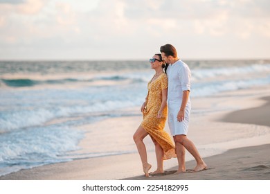 Young couple on white beach during summer vacation. - Powered by Shutterstock