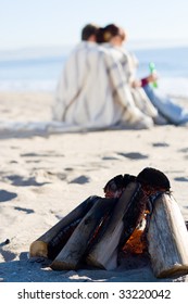 Young Couple On Winter Beach