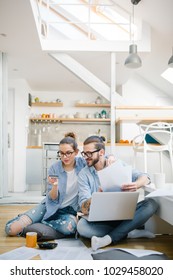 Young Couple Paying Bills With Credit Card