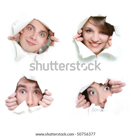 young couple peeping through hole in paper