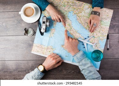 Young couple planning honeymoon vacation trip with map. Top view. Pointing to Europe Rome - Shutterstock ID 293482145