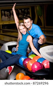 A Young Couple Playing Bowling