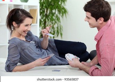 Young Couple Playing Cards Together