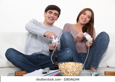 Young Couple Playing Computer Games