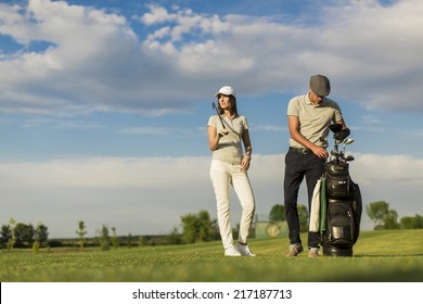 Young Couple Playing Golf