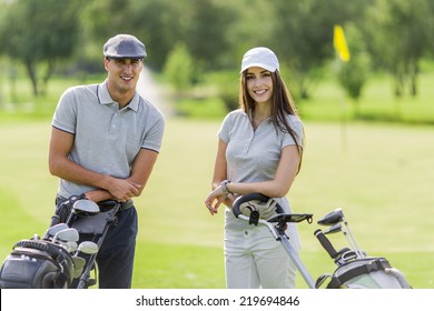 Young Couple Playing Golf