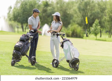 Young Couple Playing Golf